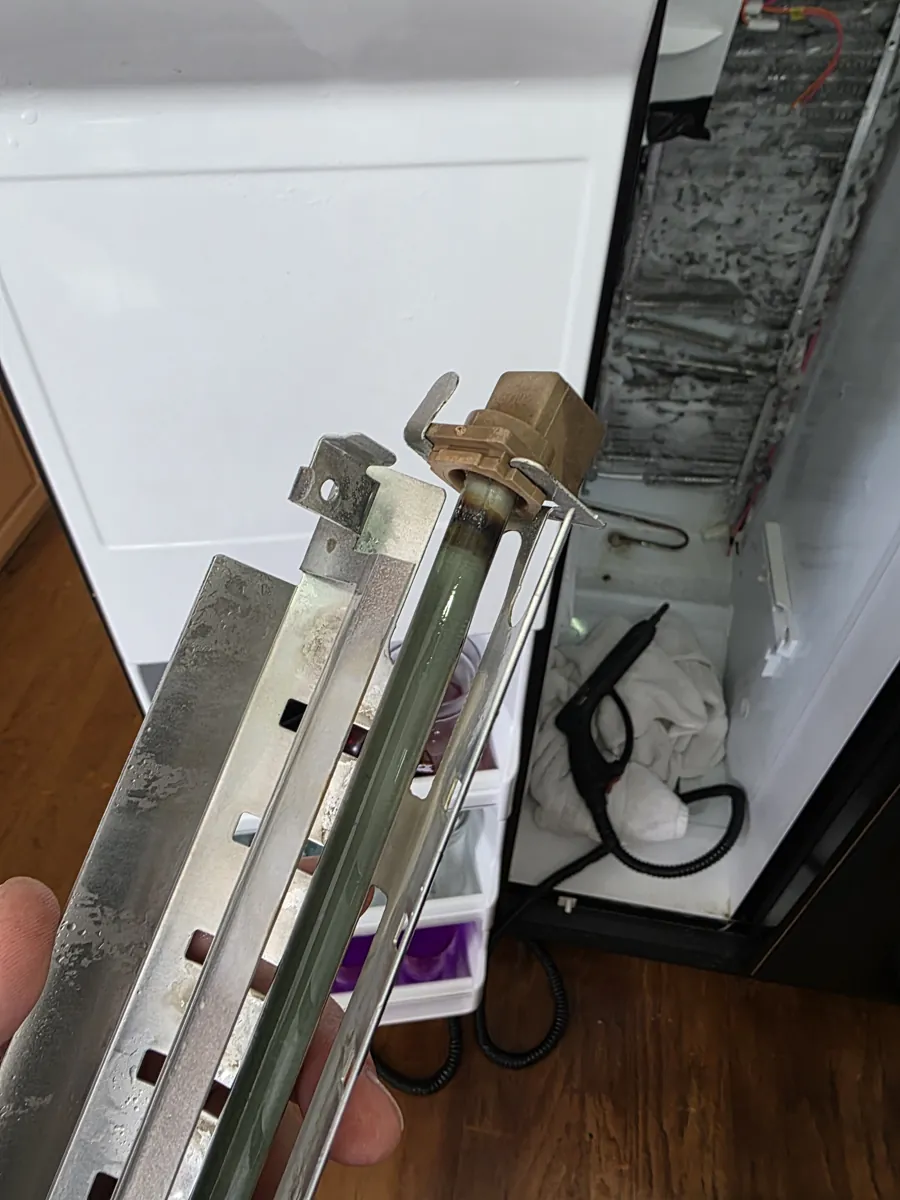 Ice build-up on the evaporator of a GE side-by-side refrigerator freezer