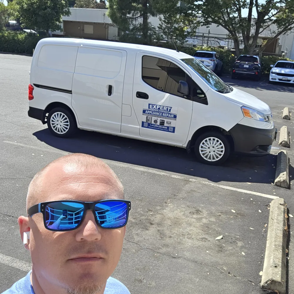 Expert Repair Company technician with the service van