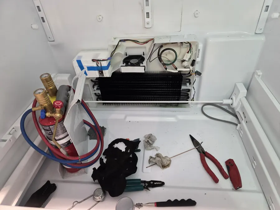 New evaporator coil and tools laid out for a Viking refrigerator repair